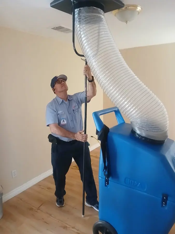HVAC Installation technician using HEPA equipment in Katy